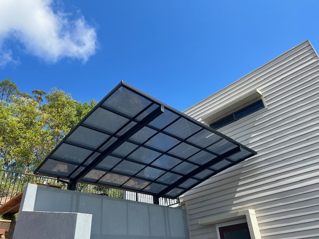 Completed steel and polycarbonate carport