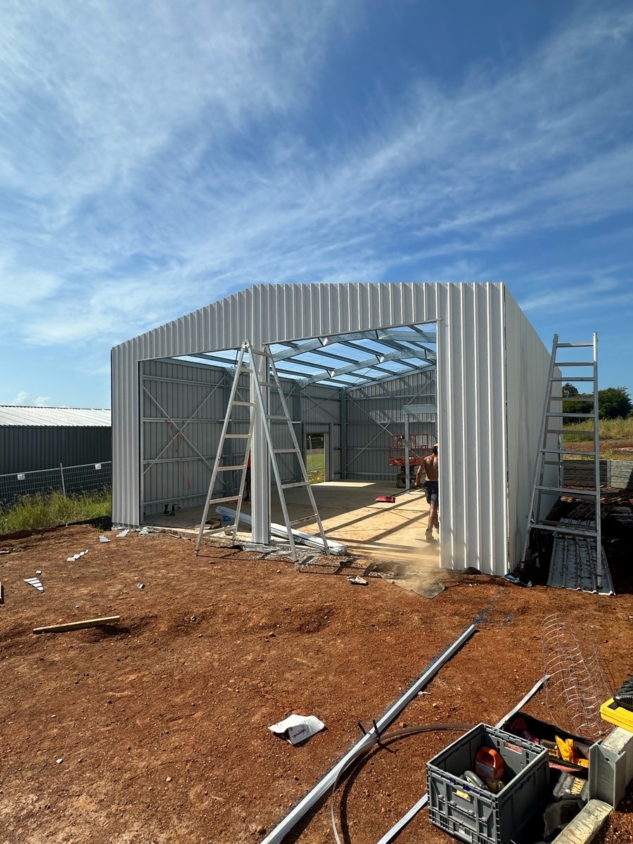 Shed wall cladding installation in progress